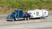Kenworth with Quads and Trailer on I-5.JPG